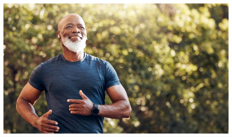 Man running through woodland