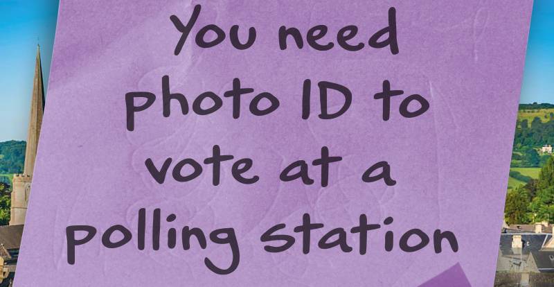 A post-it note that reads, "You need photo ID to vote at a polling station"